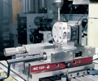 The PositiveLock system provides for a totally new way to make round parts. In this example, a round part is completely machined from all sides by indexing it 90 degrees using the QuickPoint vertical stand. The remaining 0.08 inch (2 mm) of material is turned off on a turning center.