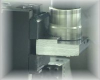 Face milling hot-rolled bar stock held in a PositiveLock vise jaw.